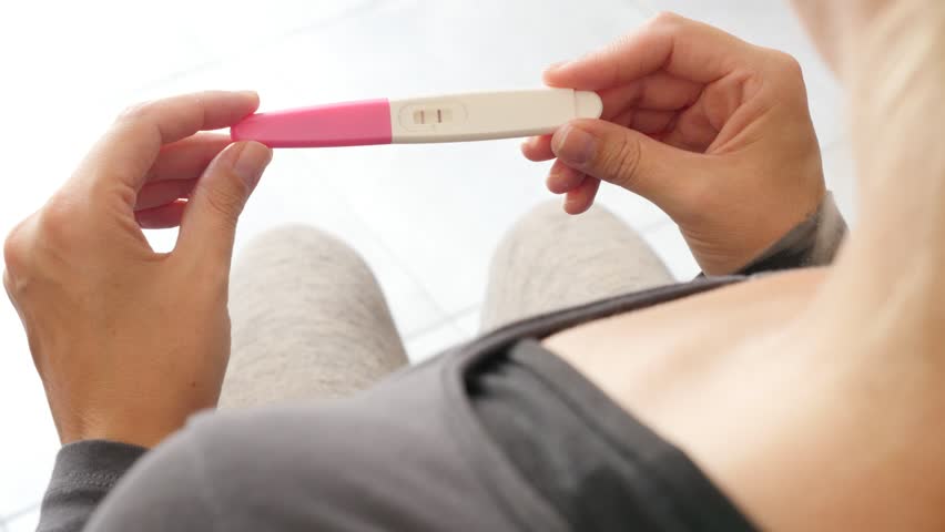 Pregnancy Test In Action. One Line Means Not Pregnant. CG ...