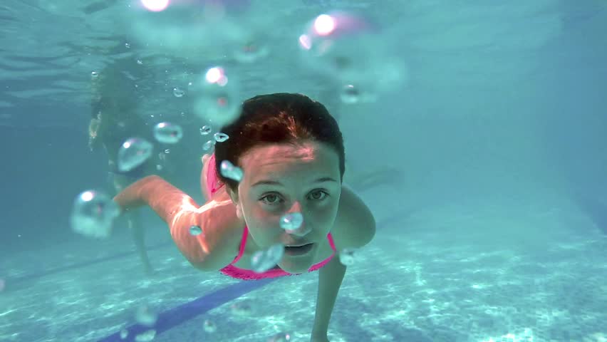 Woman Swim In Blue Pool Underwater Video Stock Footage
