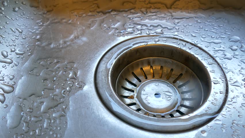 water spraying under kitchen sink