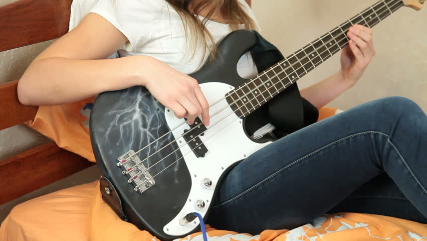 Teen Girl Playing Bass Guitar At Home Stock Footage Video 3358700