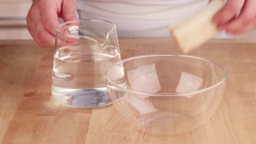 Bread Being Soften In Lukewarm Water Stock Footage Video 4264736 