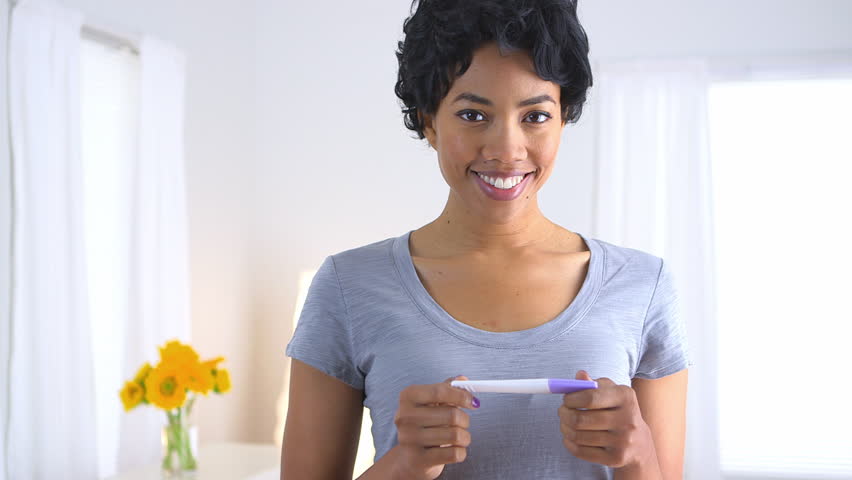 Happy Black Woman With Pregnancy Test Стоковые футажи для видео 4377215 - Shutterstock
