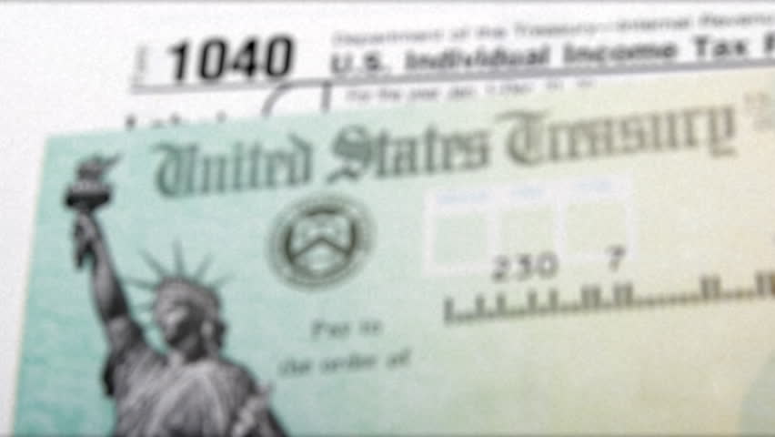 Zooming Out Shot Of 1040 Income Tax Return Form With Federal Tax Return 