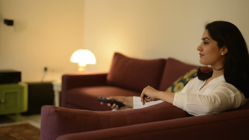 Woman Watching Tv In Living Room