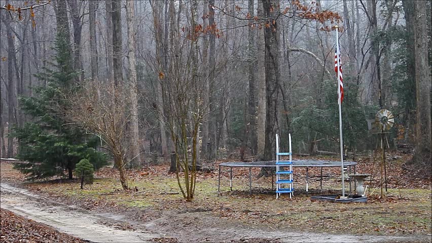 windmill and a trampoline outside on a winter day - HD stock video