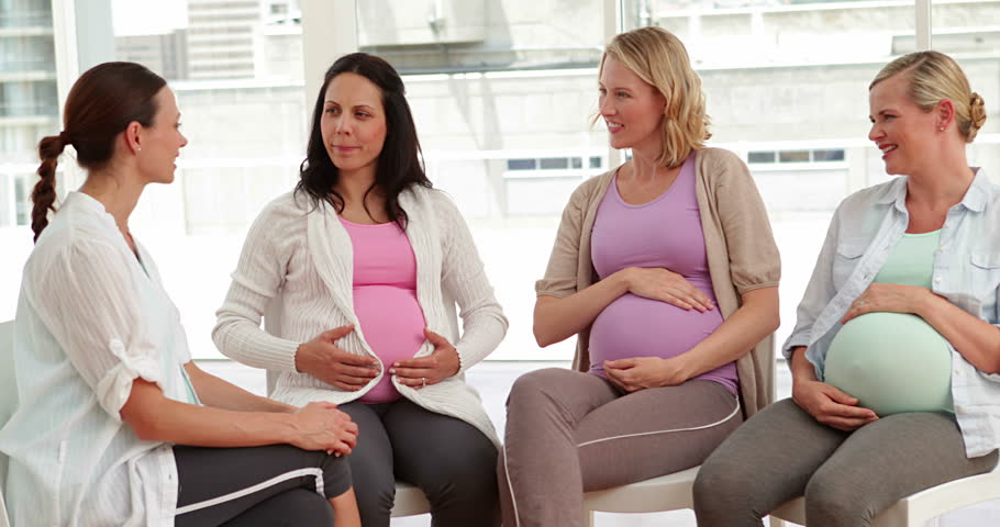 Pregnant Women Talking Together At Antenatal Class At The Hospital