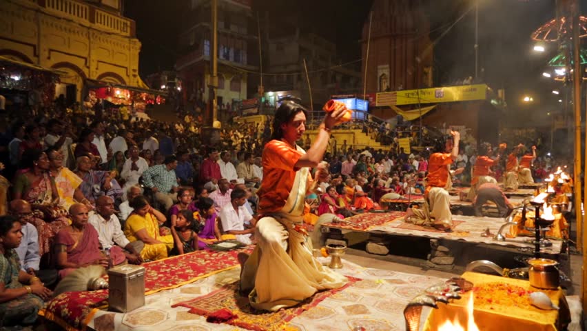 VARANASI, INDIA - CIRCA MAY 2014: An Unidentified Hindu Priest Performs