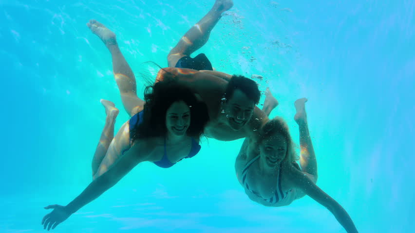 Smiling Brunette In Yellow Bikini Swimming Underwater In