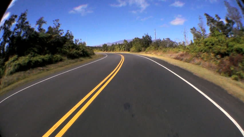 point-of-view-fish-eye-driving-a-metalled-road-through-rural