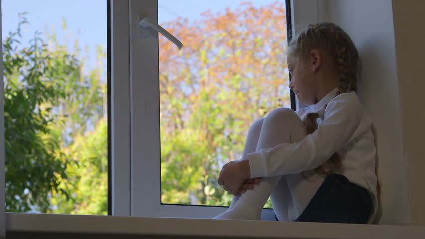 Sad Alone Child Looking Out Window Glass Home In The Room Thinking