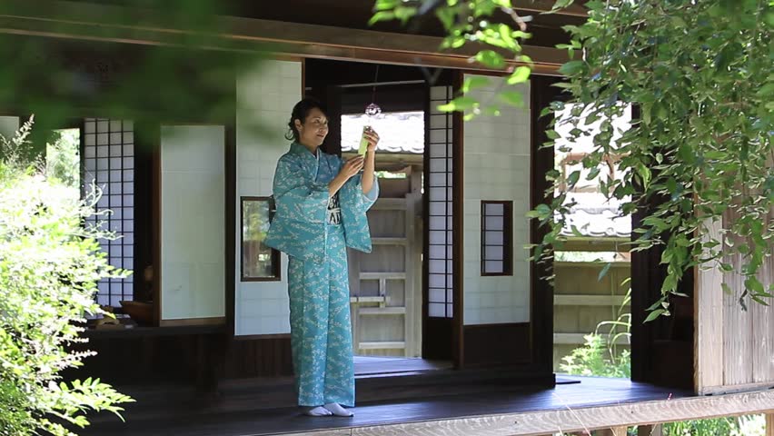Japanese Wind Chime Stock Footage Video Shutterstock Japanese Woman In A Kimono Hanging Wind Chime Traditional House