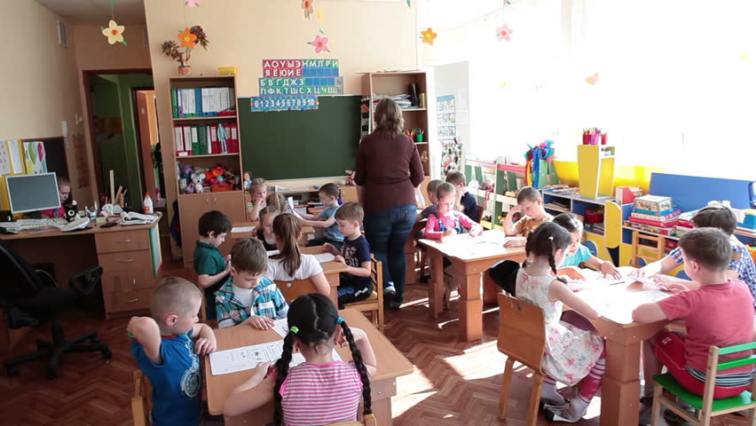 ST. PETERSBURG, RUSSIA - CIRCA MAY, 2015: Educators Help Children A ...