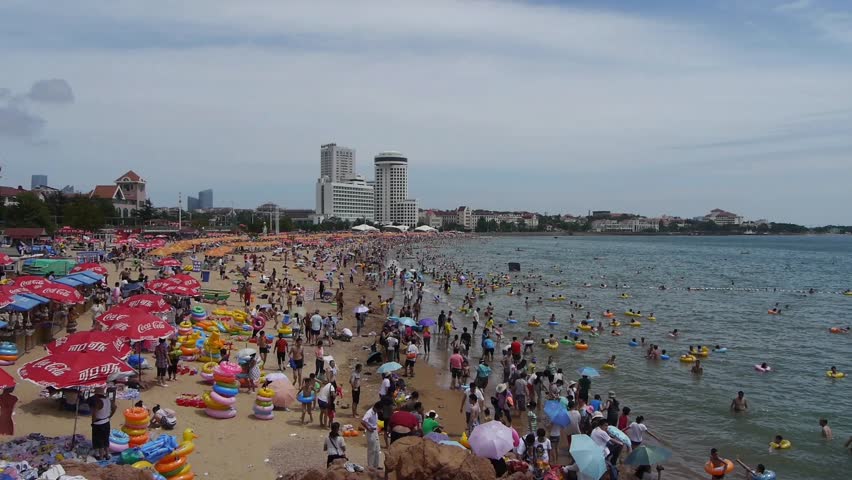 QINGDAO,CHINA - AUG 13, 2013,A Lot Of People At Crowded Bathing Sandy ...