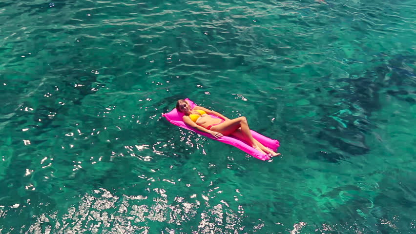 Woman Floating On Pool Raft In The Sea Stock Footage Video 1308010 ...