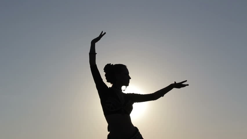 Indian Girl In Traditional Dance Costume Dances Against A Black ...