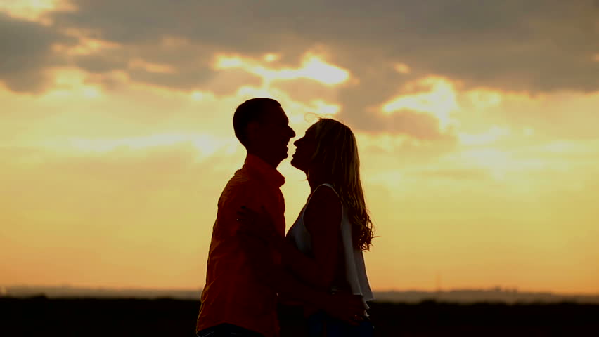 Silhouette Of Couple Holding Each Other. Medium Shot. Stock Footage ...