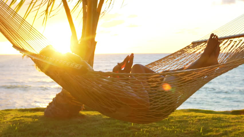 Romantic Couple Relaxing In Tropical Hammock At Sunset. Summer Luxury ...