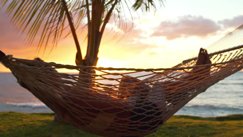 Romantic Couple Relaxing In Tropical Hammock At Sunset. Summer Luxury ...