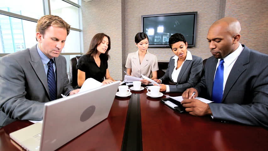 Multi Ethnic Executive Team Using A Video Link For A Conference ...