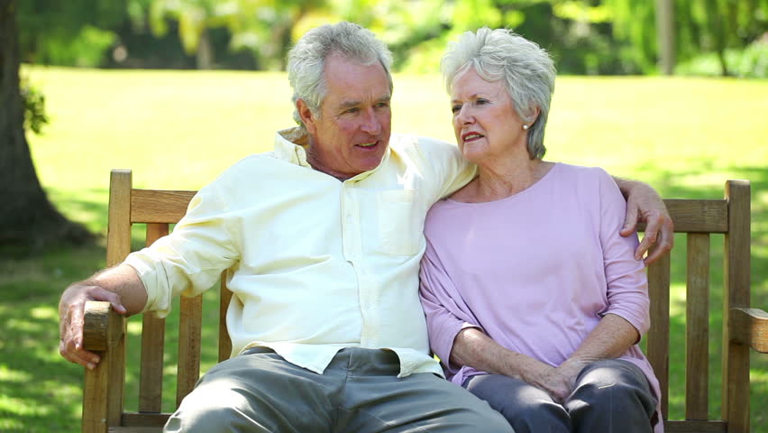 Retired Couple Sitting On A Bench In A Park Stock Footage Video 3050626 ...