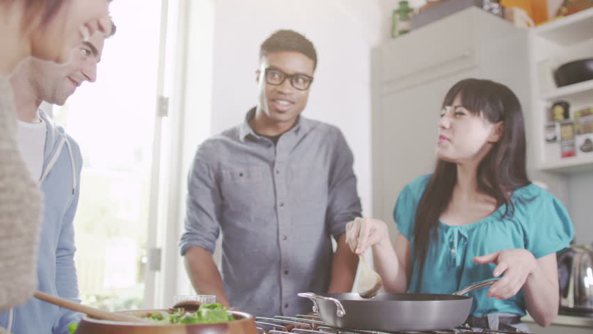 Young People In The Kitchen Prepare For A Party. Friends Cooking And ...