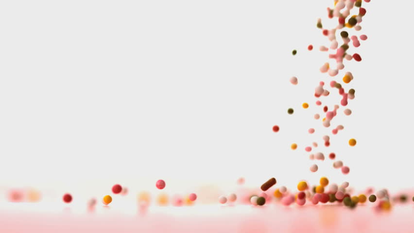 Sprinkles Falling On Pink Surface In Slow Motion Stock Footage Video ...