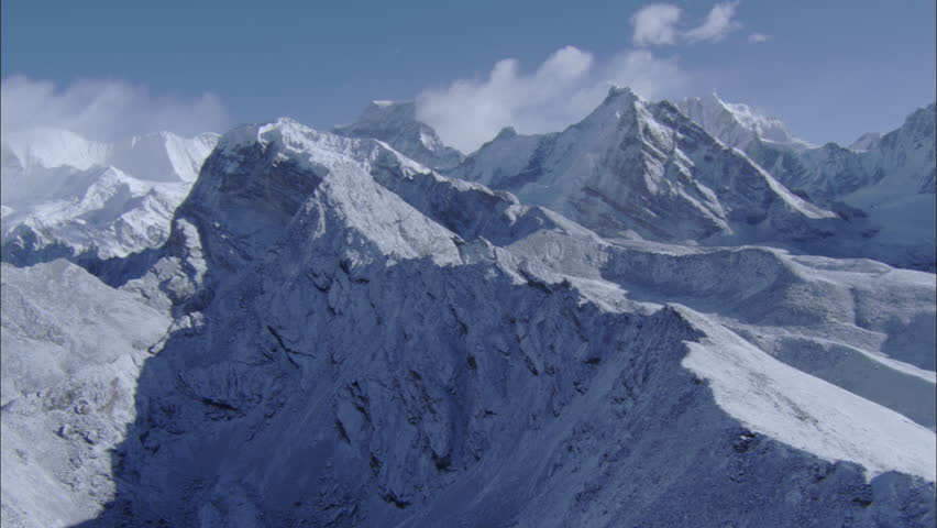 White Snow Rocky Mountains. White Snow Covered Mountain Ranges Surround ...