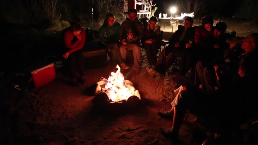 Family Sitting Around Campfire While Camping Stock Footage Video ...