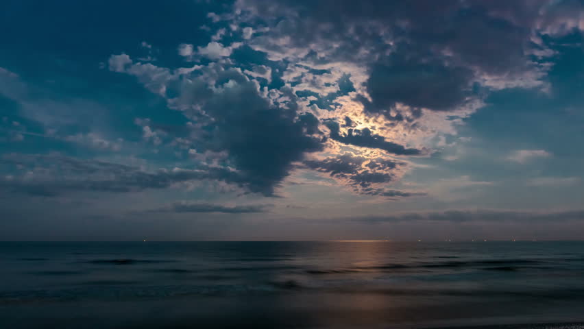 Moon Over Ocean Night Timelapse. Cloudy Sky. Horizon Over Water. Non ...