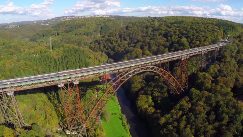 A Train Going Over A Bridge In The Mountains. Stock Footage Video ...