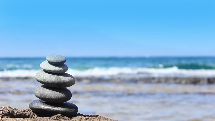 Stones Pyramid On The Beach. Ocean In The Background Stock Footage ...