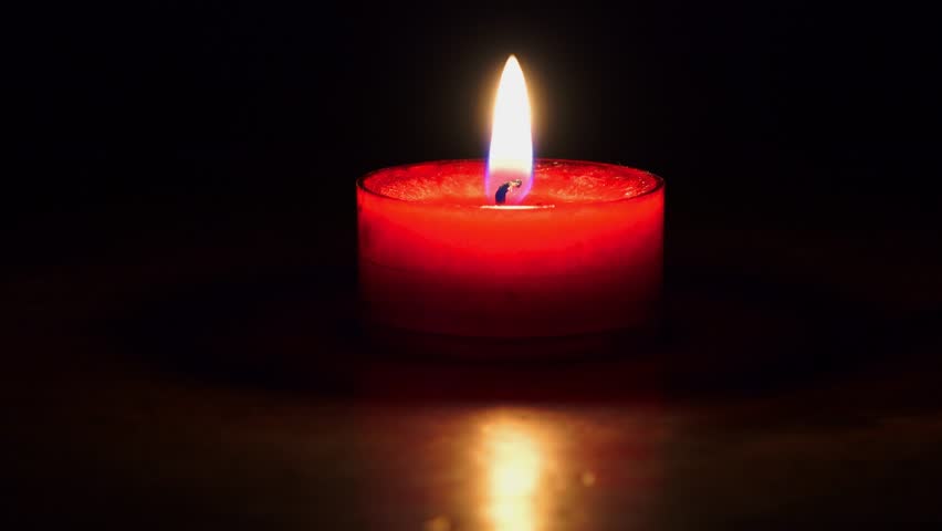 Soft Red Candle Lights With Reflections Against Black Background Stock ...