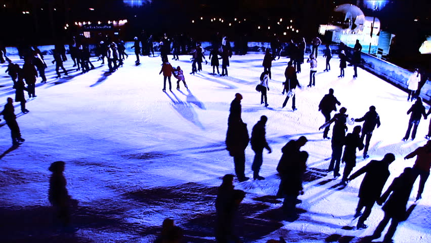 Winter Outdoor Ice Skating With Christmas Lights & Crowds Of People At ...